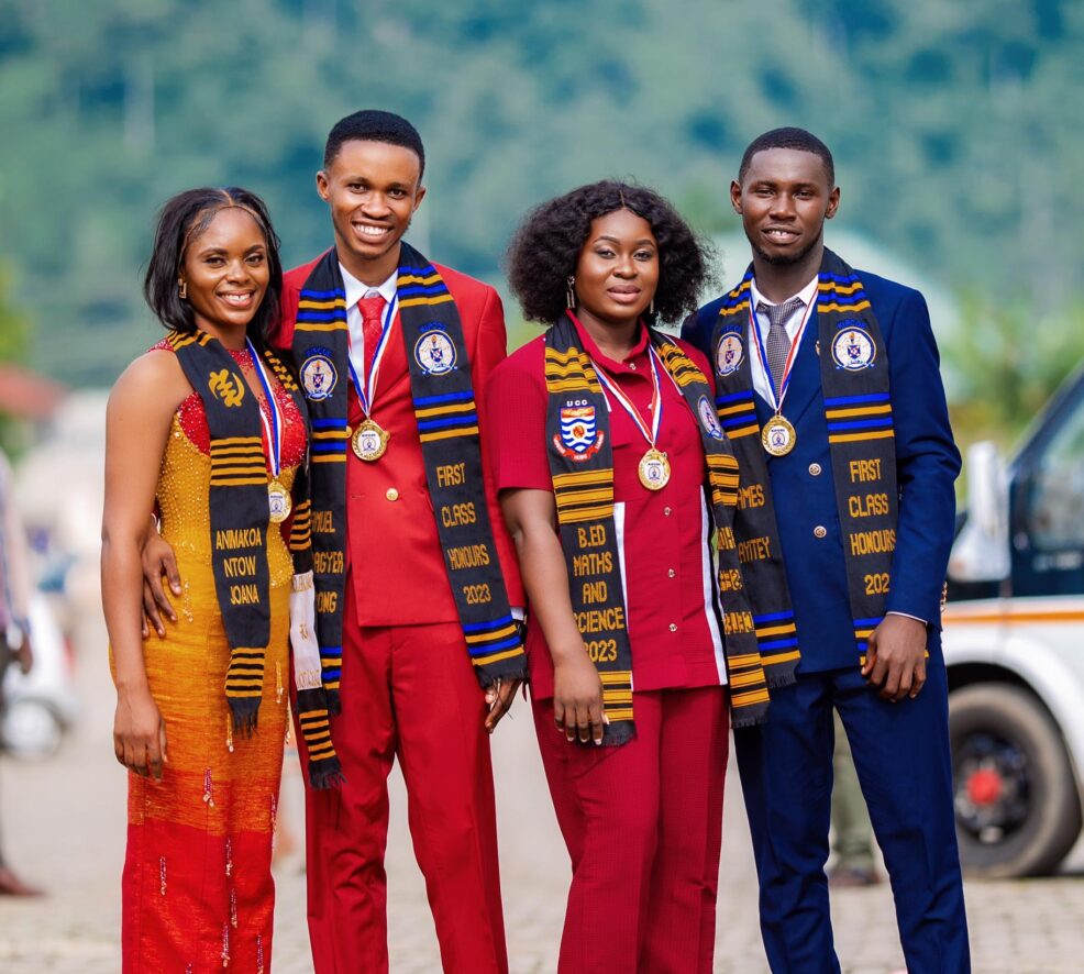 Graduates in formal wear with authentic Kente Graduation Stoles and medals